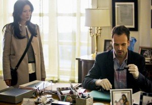 Elementary -- Jonny Lee Miller plays Sherlock Holmes and Lucy Liu plays Dr. Joan Watson.